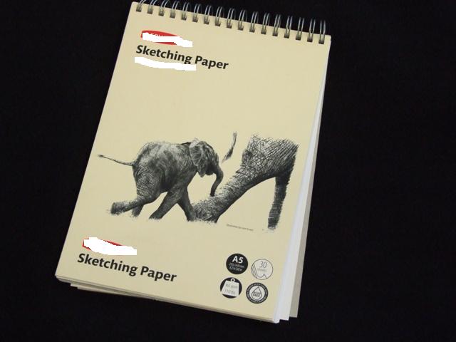 A SPIRAL BOUND SKETCH PAPER PAD WITH A CARD COVER. THE COVER IS ILLUSTRATED  WITH ELEPHANTS. CONTAINS 30 SHEETS OF A5 ACID FREE PAPER. MEASURES 210 X 148MM.