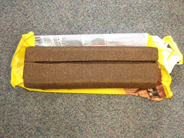 FIRELOG. OF AGGLOMERATED SAWDUST MIXED WITH FATTY ACID WAXES. NET WEIGHT 6 LBS. PACKAGED IN A LIGHTABLE WRAPPER. THE LOG IS DESIGNED TO BURNT BY LIGHTING THE WRAPPER AND WILL BURN SLOWLY FOR UP TO 3 AND HALF HOURS. WITH LIGHTING AND SAFETY INSTRUCTIONS PRINTED ON THE WRAPPER.
