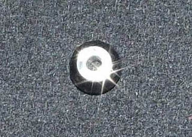 TIGERS EYE BEAD WITH A STERLING SILVER INSERT. THE THREADING HOLE  IN THE BEAD IS LINED WITH STERLING SILVER, THIS IS CALLED THE INSERT. THE BEAD  IS DESIGNED TO BE THREADED ONTO A FLEXIBLE BRACELET ALONG WITH OTHER SIMILAR BEADS OR CHARMS IN COLOURS OR DESIGNS OF THE WEARERS CHOICE. DIMENSIONS,  APPROXIMATELY 14MM IN DIAMETER.