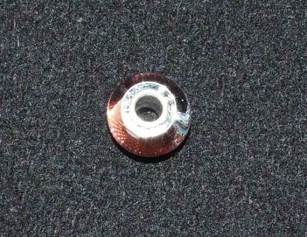 MURANO GLASS BEAD WITH A STERLING SILVER INSERT. THE THREADING HOLE  IN THE BEAD IS LINED WITH STERLING SILVER, THIS IS CALLED THE INSERT. THE BEAD  IS DESIGNED TO BE THREADED ONTO A FLEXIBLE BRACELET ALONG WITH OTHER SIMILAR BEADS OR CHARMS IN COLOURS OR DESIGNS OF THE WEARERS CHOICE. DIMENSIONS,  APPROXIMATELY 14MM IN DIAMETER.