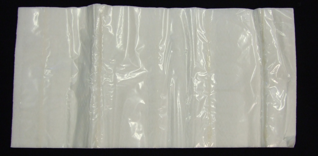 A POULTICE AND WOUND DRESSING FOR VETERINARY USE. HAVING A NON-WOVEN LOW ADHERENT SKIN CONTACT LAYER, A COTTON WOOL INTERNAL LAYER AND A CUSHIONED PROTECTIVE LAYER WITH A PLASTIC PROTECTIVE LAYER. THE DRESSING HAS AN IMPREGNATION OF 6.02GMS OF TRAGACANTH AND 2.08GMS OF BORIC ACID (AS BASSORIN E POWDER 8.10GMS). PRESENTED IN AN INDIVIDUAL SEALED PLASTIC PACK.