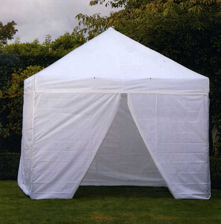 A  10 X 10  CATHEDRAL FOLDING TENT.  AN ALUMINIUM FRAME WITH WOVEN POLYESTER
SIDES. WHITE IN COLOUR WITH A FRONT OPENING.