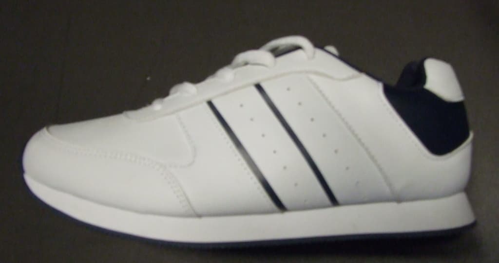 UNISEX TRAINING SHOE. NOT COVERING THE ANKLE. UPPERS OF PLASTIC. OUTER SOLES OF SYNTHETIC MATERIAL WITH A GRIP. WITH SPECIAL TECHNOLOGY IN THE FORM OF AN EVA MIDSOLE. LOGO ON TONGUE. INSOLE LENGTH EXCEEDS 24CMS. 5 EYELETS WITH LACE-UP FASTENING. WHITE IN COLOUR WITH TWO BLUE STRIPES EACH SIDE OF THE TRAINING SHOE.