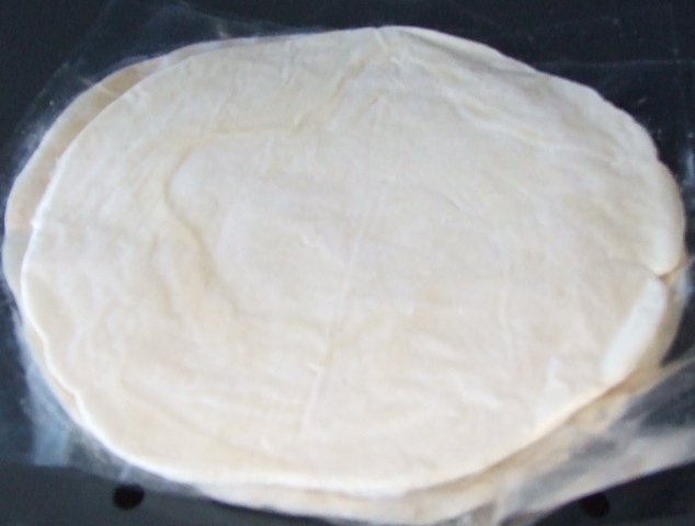 PLAIN PARATHA; AN UNLEAVENED FLAT BREAD MADE FROM WHEAT FLOUR, PALM OIL, MARGERINE (CONTAINING HYDROGENATED PALM OIL), SUGAR AND SALT.  THE PARATHAS ARE IN THE FORM OF AN UNCOOKED WHITE SOFT ELASTIC DOUGH, IN THE SHAPE OF A DISC WITH A DIAMETER OF APPROXIMATELY 18 CM, FROZEN.  THEY ARE INTENDED TO BE COOKED IN A FRYING PAN FROM FROZEN AND ARE PACKAGED IN  A PLASTIC POUCH CONTAINING 6 PARATHAS.