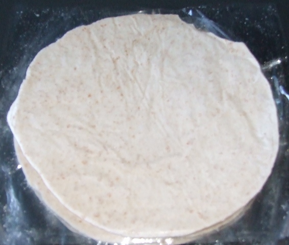 FROZEN WHOLEMEAL LACHA PARATHA; A MULTILAYERED FLATBREAD.  INGREDIENTS ARE WHEAT FLOUR, WATER, MARGARINE (PALM OIL BASE), SALT AND BAKING POWDER. THE PARATHA IS IN THE FORM OF AN UNCOOKED DOUGH IN THE SHAPE OF A DISC, THAT HAS BEEN FROZEN.  IT IS INTENDED TO BE PAN COOKED FROM FROZEN BEFORE CONSUMPTION.  THE PARATHA IS PACKED IN QUANTITIES OF FIVE IN A PRINTED PLASTIC POUCH, NET WEIGHT 400G.