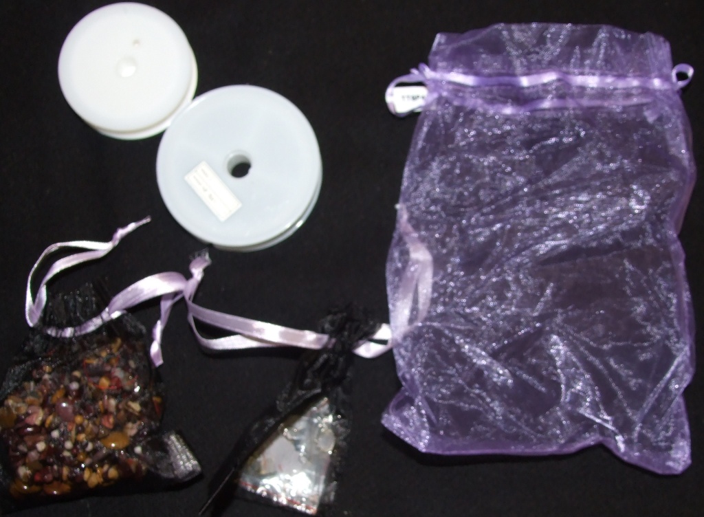 A JEWELLERY KIT COMPRISING OF MOOKITE  PLAIN ROUNDS, 4MM, MOOKITE PUFFY OVALS 10 X 14MM, MOOKITE SMALL NUGGETS, STERLING SILVER CRIMP BEADS, STERLING SILVER SHEPHERD HOOKS, STERLING SILVER HEADPINS, CLASP, REEL OF CLEAR ELASTIC STRING  AND A REEL OF WIRE, WITH ONE LARGE AND TWO SMALL GIFT BAGS.