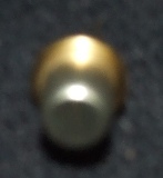 A CLOSED GLASS BASED VARIABLE RESISTOR, DESIGNED FOR USE IN GAS DETECTOR DEVICES.  THE RESISTOR ELEMENT IS MADE UP OF A NUMBER OF LAYERS.  IT COMPRISES OF A WIRE SUBSTRATE THROUGH WHICH CURRENT IS APPLIED.  MOUNTED ONTO THE WIRE IS A GLASS BEAD ENCASED IN AN ACTIVE CHEMICAL TOP LAYER,  MOUNTED IN A METAL HOUSING.  THE METAL HOUSING IS SEALED SO THAT GAS IN THE SURROUNDING ATMOSPHERE CANNOT INTERACT WITH THE RESISTOR, AS THE RESISTANCE OF THE ACTIVE LAYER OF THE BEAD WILL VARY AS THE CHEMICAL ENVELOPING IT REACTS WITH A NUMBER OF POTENTIALLY EXPLOSIVE GASES.  EXPOSED AND NON EXPOSED RESISTORS ARE UTILISED IN PAIRS ACROSS A WHEATSTONE BRIDGE.  AS A RESULT, THE RESISTANCE OF THE NON EXPOSED RESISTOR CAN BE COMPARED TO THAT OF THE EXPOSED ELEMENT.  THE RESULTANT DIFFERENTIAL IN RESISTANCE ALLOWS FOR GAS DETECTION WHEN THE COMBINED RESISTOR  ASSEMBLY IS MOUNTED IN A GAS DETECTOR.  THE USE OF IDENTICAL SEALED AND NON SEALED RESISTORS IN CLOSE PROXIMITY MEANS THAT THEY WILL BE HELD AT THE SAME TEMPERATURE, THUS OVERCOMING THE INHERENT PROBLEM OF RESISTANCE VARIATION BROUGHT ABOUT THROUGH TEMPERATURE FLUCTUATION.  THE RESISTOR HAS A POWER HANDLING CAPACITY OF LESS THAN 20 WATTS.