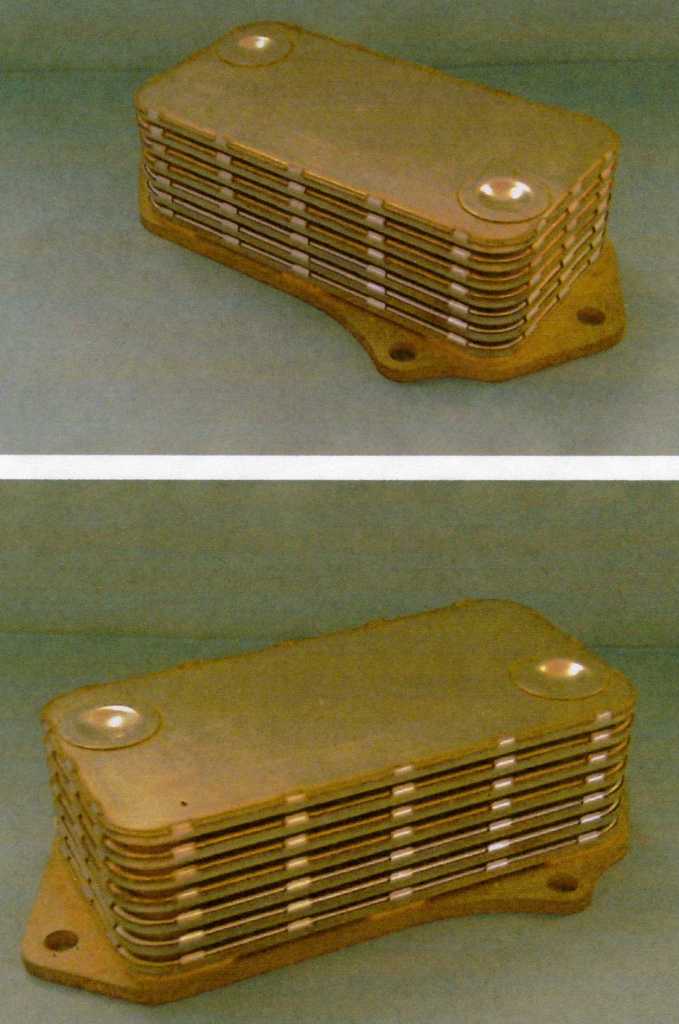 BRAZENED PLATE OIL COOLER. MADE OF STAINLESS STEEL. PART FOR BULLDOZERS, EARTH MOVING EQUIPMENT ETC. WIDTH: 130 MM, HEIGHT: 9200 MM, DEPTH: 200MM.