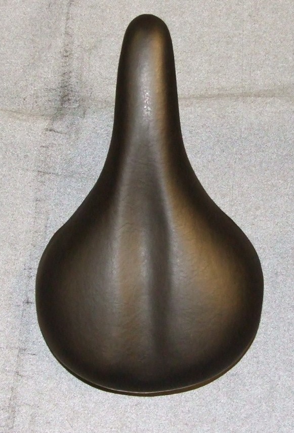 CHILDS BICYCLE SADDLE. MADE FROM PVC, FOAMING SPONGE, PP AND IRON. BLACK IN COLOUR.. MADE FROM PVC, FOAMING SPONGE, PP AND IRON. BLACK IN COLOUR.