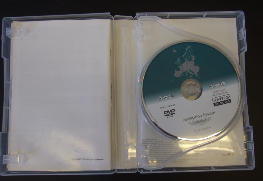 A PLASTIC DVD CASE WITH PRINTED INSERTS IN FRONT AND BACK COVER, CONTAINING 3 DVD-ROMS HOLDING MAPS OF CENTRAL, EASTERN AND WESTERN EUROPE FOR USE IN CAR NAVIGATION SYSTEM.
