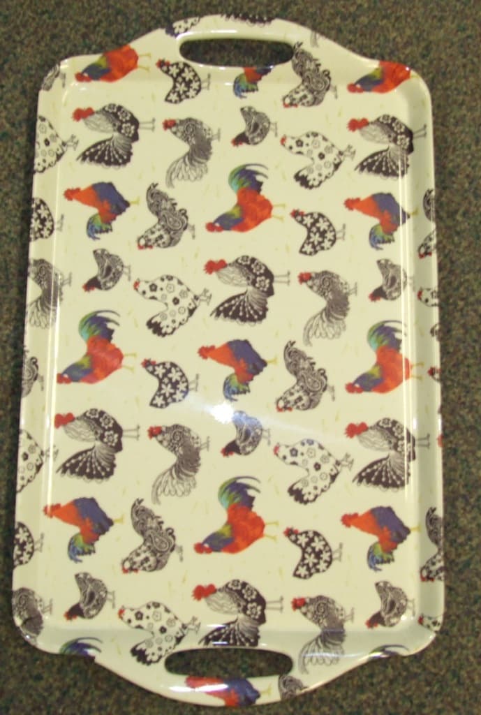 A PLASTIC MELAMINE TRAY . WITH HANDLES. DESIGNED FOR DOMESTIC/HOUSEHOLD USE. THE TOP IS DECORATED WITH A BIRD DESIGN. HE DIMENSIONS OF THE BASE OF THE TRAY ARE APPROX 39CM LENGTH X 26CM WIDTH.