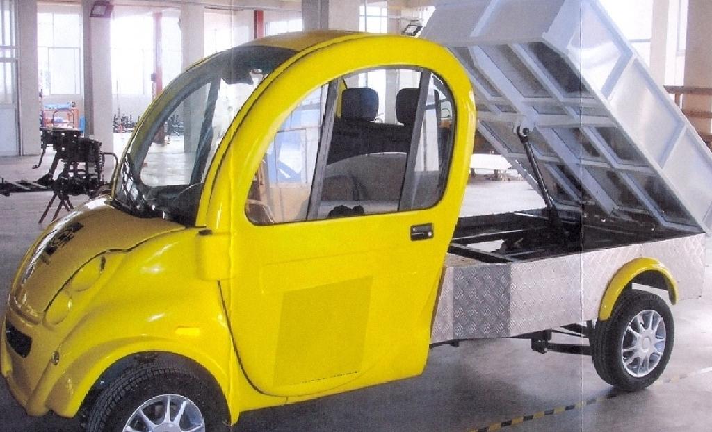ELECTRIC UTILITY VEHICLE WITH STEEL CHASSIS, FIBREGLASS BODY, ELECTRIC MOTOR WITHOUT BATTERIES AND TIPPING BED. VALUE £5000. USED AS UTILITY/GOODS TRANSPORTING VEHICLE IN CITY CENTRE AND INDUSTRIAL ENVIRONMENTS WHERE CO2 AND FUME REDUCTIONS ARE ESSENTIAL.