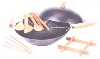 NON STICK CARBON STEEL WOK. PRESENTED IN A SET WITH ACCESSORIES THAT INCLUDE A SPATULA, A TRIVET,TONGS, A RICE PADDLE, DIFFERENT SIZE CHOP STICKS AND A METAL RACK ALL FOR USE WITH THE WOK. THE WOK IS ROUNDED IN SHAPE WITH A LID.