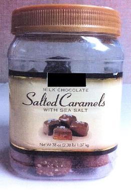 MILK CHOCOLATE SALTED CARAMELS. INGREDIENTS INCLUDE SUGAR, CORN SYRUP, EVAPORATED MILK, WHOLE MILK, HEAVY CREAM, COCOA BUTTER, CHOCOLATE LIQUOR, PALM KERNEL OIL, SEA SALT, BUTTER, COCOA, SOY LECITHIN, SALT, NATURAL AND ARTIFICIAL FLAVOUR, HYDROGENATED PALM OIL. PRESENTED IN A CLEAR JAR WITH A PRINTED LABEL. NET WEIGHT 1.07KG