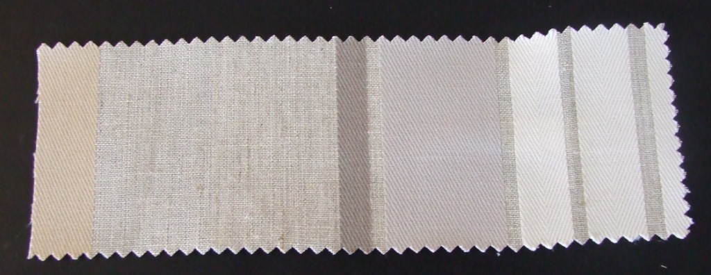 A WOVEN FABRIC MADE FROM 85 PERCENT LINEN AND 15 PERCENT COTTON.  HORIZONTAL DESIGN REPEAT = 47 CM.  THE FABRIC HAS A WIDTH OF 145 CM AND WEIGHT OF 350 GM2 AND IS MADE FROM YARNS OF DIFFERENT COLOURS.