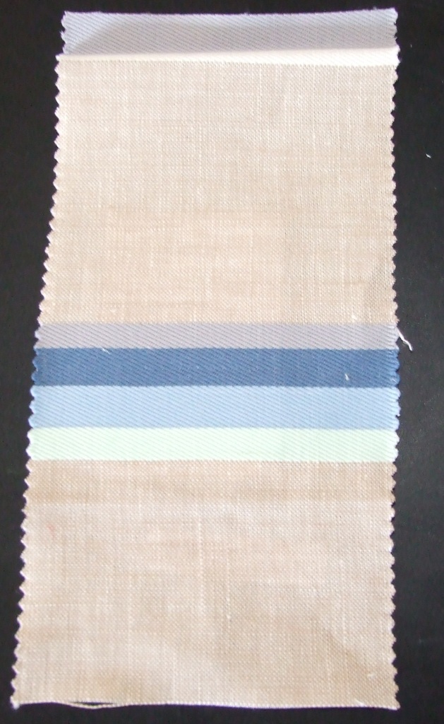 A WOVEN FABRIC MADE FROM 85 PERCENT LINEN AND 15 PERCENT COTTON.  HORIZONTAL DESIGN REPEAT = 23.5 CM.  THE FABRIC HAS A WIDTH OF 145 CM AND WEIGHT OF 241 GM2 AND IS MADE FROM YARNS OF DIFFERENT COLOURS.