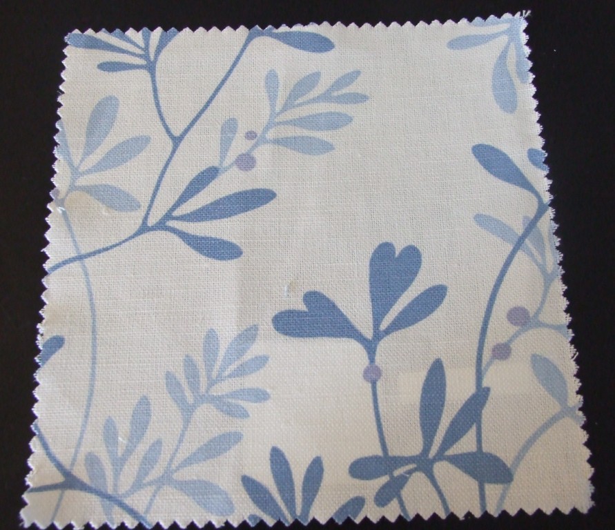 A WOVEN LEAF DESIGN FABRIC MADE FROM 51% COTTON AND 49% LINEN.  HORIZONTAL DESIGN REPEAT = 46 CM, VERTICAL DESIGN REPEAT = 38 CM.  THE FABRIC HAS A WIDTH OF 142 CM AND A WEIGHT OF 262 G/M2.  THE FABRIC IS A PLAIN WEAVE, NOT NAPPED AND MADE ON A POWERLOOM.