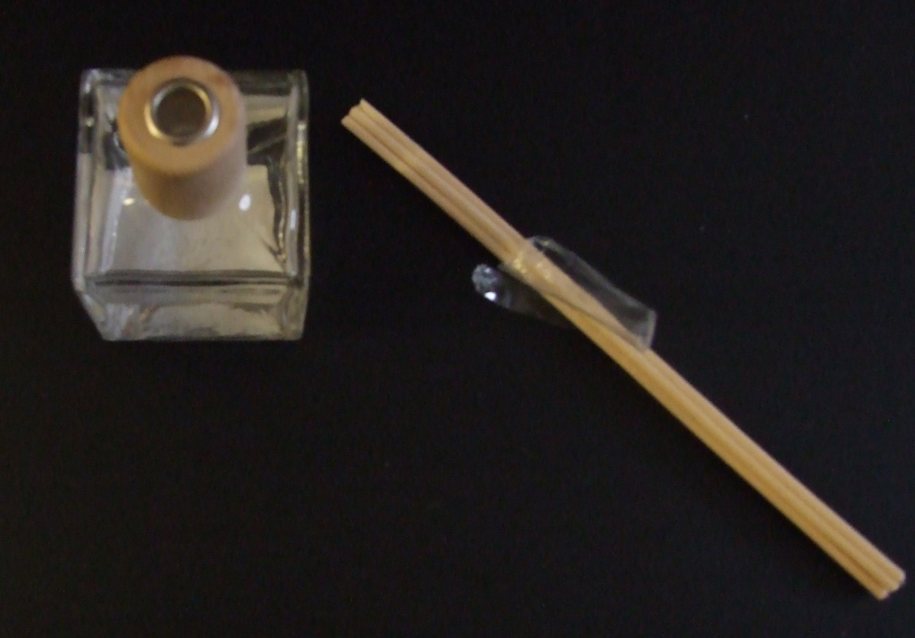 SEA ANGEL REED DIFFUSER. A ROOM FRAGANCING PREPARATION IN A GLASS BOTTLE WITH FIVE REED STICKS (SHRINK WRAPPED).