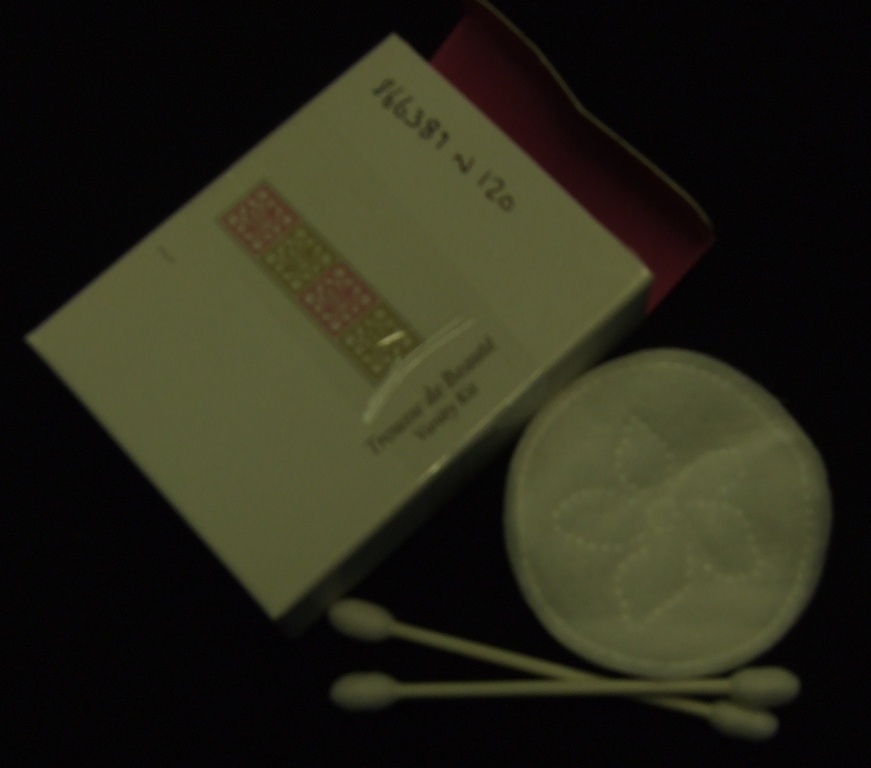 ABSORBENT PADS AND BUDS. DISPOSABLE ARTICLES OF COTTON WADDING. DESIGNED FOR ONE OFF USE. CONSISTING OF 2 SMALL CIRCULAR PADS AND ALSO 2 COTTON BUDS EACH DOUBLE ENDED ON A PLASTIC STICK. PRESENTED IN A CLEAR PLASTIC BAG INSIDE A PRINTED CARDBOARD BOX.