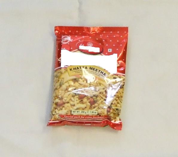 INDIAN SNACK. A SWEET AND SPICY BLEND OF GRAM FLOUR NOODLES, PUFFED RICE, GREEN PEAS AND PEANUTS.  PACKAGED IN A 200G POLY POUCH.