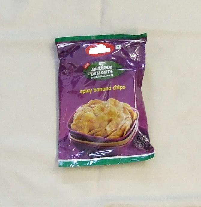 SPICY BANANA CHIPS. INGREDIENTS INCLUDE BANANAS, PALMOLEIN, SALT, PEPPER AND CUMIN SEED POWDER. PACKAGED IN 200G POLY POUCH PACK.