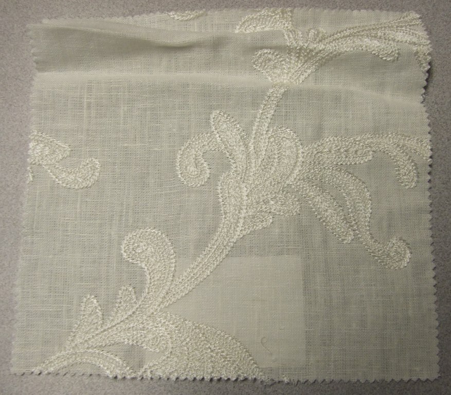 WOVEN EMBROIDERED FABRIC. VISIBLE GROUND FABRIC OF LINEN, WITH EMBROIDERED FLORAL PATTERN OF 90% VISCOSE AND 10% POLYESTER. TOTAL FIBRE CONTENT 64% LINEN, 32% VISCOSE AND 4% POLYESTER. WEIGHING 341 GRAMS PER METRE SQUARED. WIDTH 132CM. NOT MANUFACTURED ON A HAND LOOM. VALUE EXCEEDS 17.5 EUROS PER KG NET WEIGHT.
