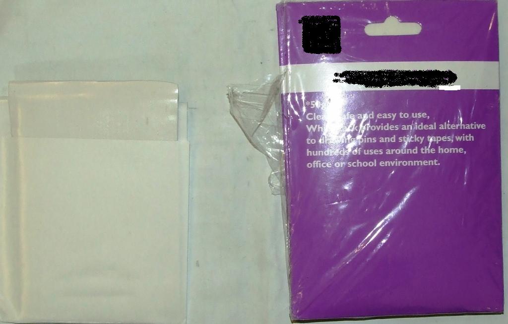 RE-USABLE ADHESIVE STRIPS OF 100% CALCIUM CARBONATE FOR USE AS AN ALTERNATIVE TO DRAWING PINS AND STICKY TAPES.