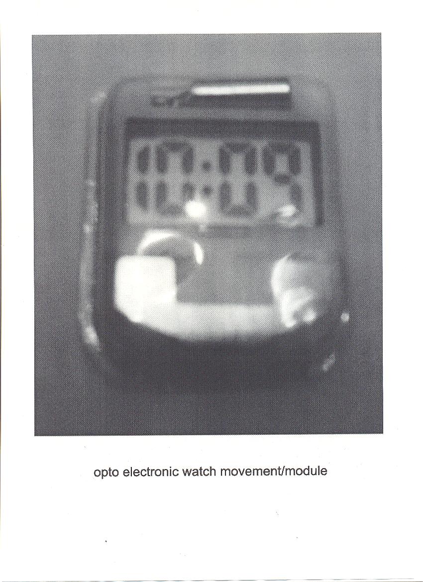OPTO ELECTRONIC WATCH MOVEMENT INCLUDING BATTERY. OPTOELECTRONIC WITH LCD DISPLAY.  APPROXIMATE MEASUREMENTS 20MM X 25MM X5MM. PRODUCED USING SMT PROCESS, WAFER PCD, ICD CHARACTER MODULE, OSCILLATOR.