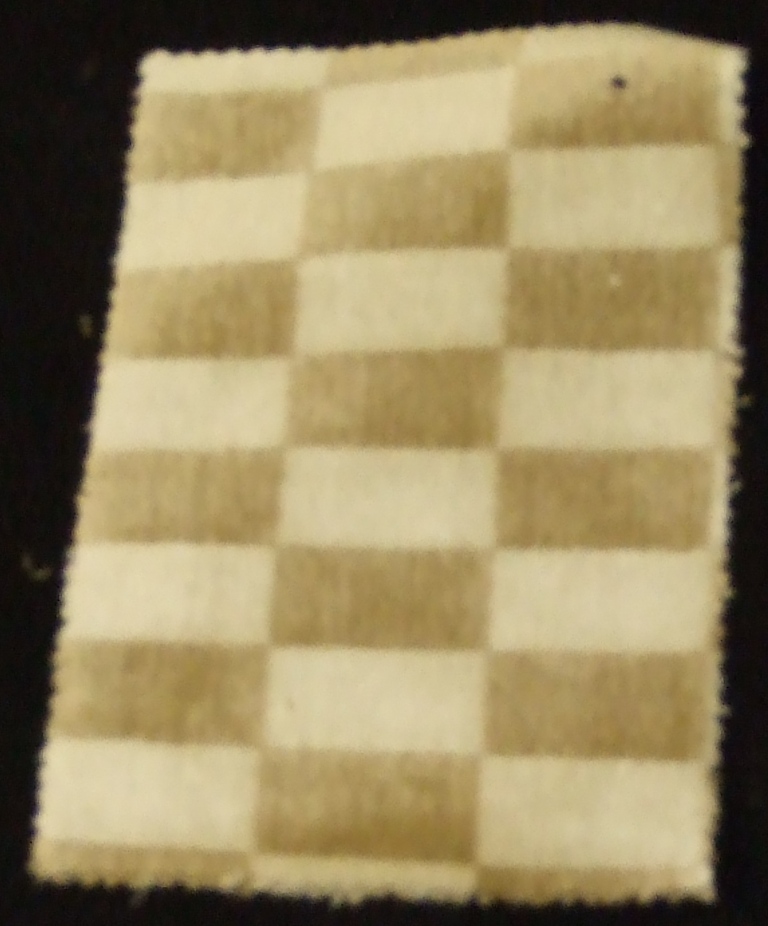 A WARP CUT PILE VISCOSE AND POLYESTER FABRIC.  IT IS MADE FROM YARNS OF DIFFERENT COLOURS.  OVERALL COMPOSITION IS 75% VISCOSE AND 25% POLYESTER. VERTICAL DESIGN REPEAT IS 4CM AND HORIZONTAL DESIGN REPEAT IS 7CM. THE FABRIC HAS A WIDTH OF 142 CM AND GRAMS PER M2 710.  VALUE EXCEEDS 17.5 EUROS PER KG.  MADE ON A JACQUARD VELVET LOOM.