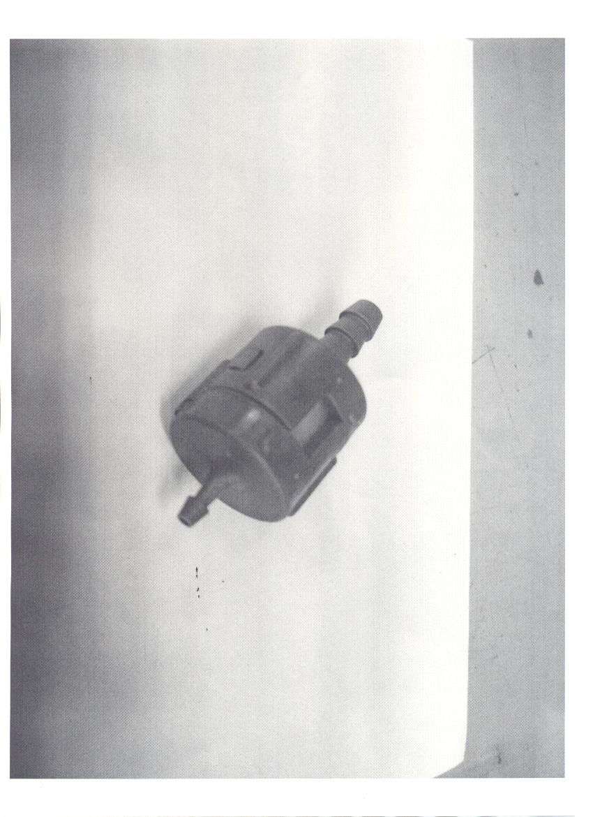CHECK VALVE.THE COMPONENT CONSISTS OF A PLASTIC HOUSING, TWO RUBBER WASHER AND A ONE-WAY VALVE, ASSEMBLED IN SERIES TO MAKE A SINGLE CHECK VALVE, ENABLING FLOW IN SINGLE DIRECTION ONLY. THE UNIT CAN WITHSTAND MAXIMUM PRESSURE 0.5 PSI.