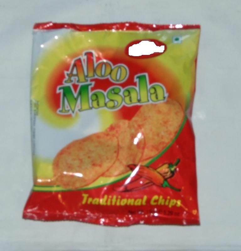 ALOO MASALA CHIPS. SUNDRIED SPICY FRIED POTATO CHIPS. INGREDIENTS INCLUDE POTATO, VEGETABLE OIL, SALT, RED CHILLI POWDER, MANGO POWDER. PACKAGED IN 150G PACKS.