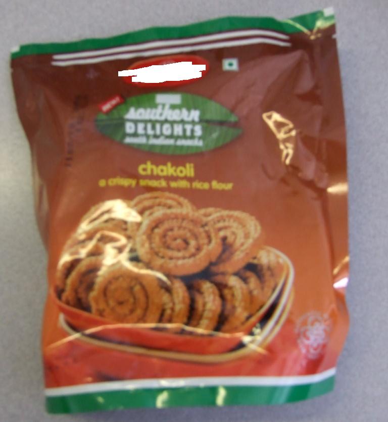 CHAKOLI. A CRISPY SNACK WITH RICE FLOUR. INGREDIENTS INCLUDE RICE FLOUR 45%, PALMOLEIN 34%, AND GRAM PULSE FLOUR 16%.  EXTRUDED PRODUCT. PACKAGED IN 200G POLY POUCHES.