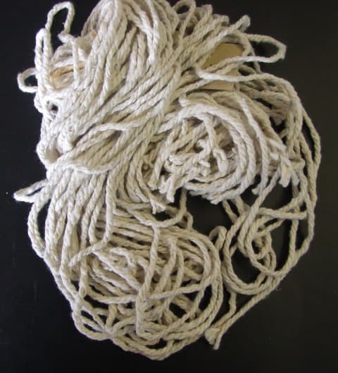 UNCOMBED FOLDED SPUN YARN. OF 89.9% COTTON, 9.7& POLYESTER, 0.4% OTHER FIBRES. WITH 3 FOLDS. OF A DECITEX OF 7058. FOR USE IN THE MANUFACTURE OF MOP HEADS.