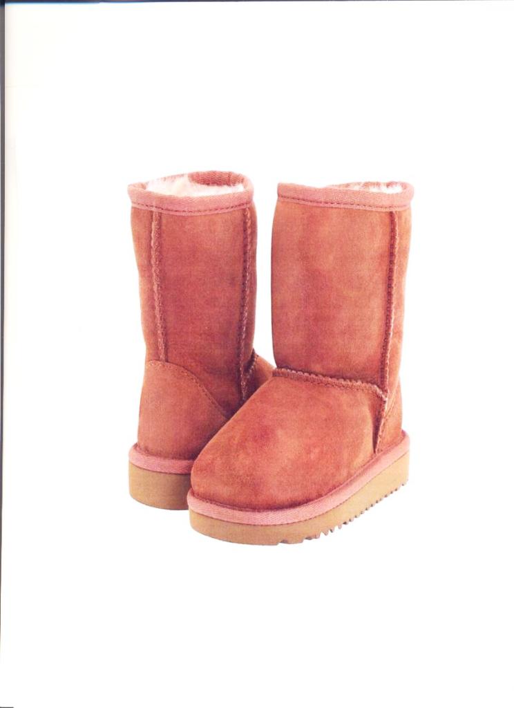 UNISEX TAN SUEDE BOOTS. UPPER OF FURSKIN AND OUTER SOLES OF RUBBER/PLASTIC. COVERING THE CALF BUT NO PART OF THE KNEE. TIE UP FASTENING TO SIDE OF THE BOOT. TAN IN COLOUR.