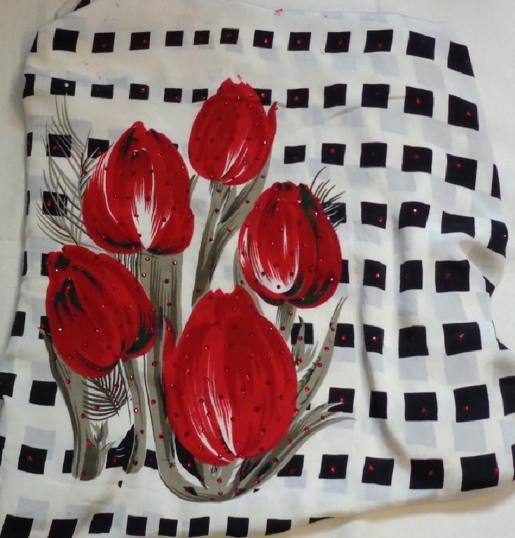 A 100 PERCENT POLYESTER WOVEN PRINTED FABRIC. EMBELLISHED WITH CRYSTAL STONES. WIDTH APPROXIMATELY 150 CM. MAINLY USED FOR DRESS MAKING AND FASHION CLOTHING.