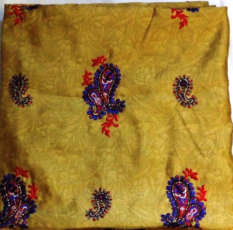 A 100 PERCENT POLYESTER WOVEN PRINTED AND APPLIQUE WORK EMBROIDERED FABRIC WITH VISIBLE GROUND. WIDTH APPROXIMATELY 150 CM. MAINLY USED FOR DRESS MAKING AND FASHION CLOTHING. VALUE LESS THAN 17.50 EURO / KG.