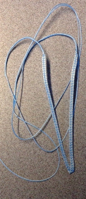 A MADE-UP NON STERILE, UNCOATED FIBRE WIRE TAPE LOOP MADE OF POLYETHYLENE FIBRE AND POLYESTER, WHERE THE POLYETHYLENE PREDOMINATES. THE MATERIAL IS BRAIDED. DECITEX OF THE MATERIAL IS 2,344. CUT TO LENGTH, MEASURING APPROXIMATELY 60.5CMS LONG WITH THE MIDDLE 19CM SECTION BEING FLATTENED. TO BE USED IN SURGERY.