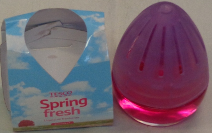 PERFUMED LIQUID AIR FRESHNER. PACKAGED IN A GLASS BOTTLE. WITH A REMOVABLE LID AND PLASTIC VENTED CAP THAT OPENS AND CLOSES WHEN TWISTED. WITH A CARDBOARD SLEEVE