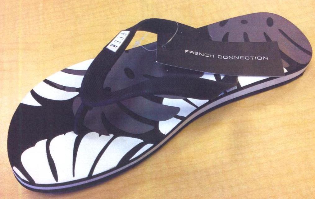 MENS THONG STYLE FLIP FLOP. WITH AN UPPER COMPRISING OF A PLASTIC STRAP ASSEMBLED TO THE SOLE BY MEANS OF PLUGS. OUTER SOLES OF PLASTIC. INSOLE LENGTH MORE THAN 24CMS. BLACK AND WHITE IN COLOUR.