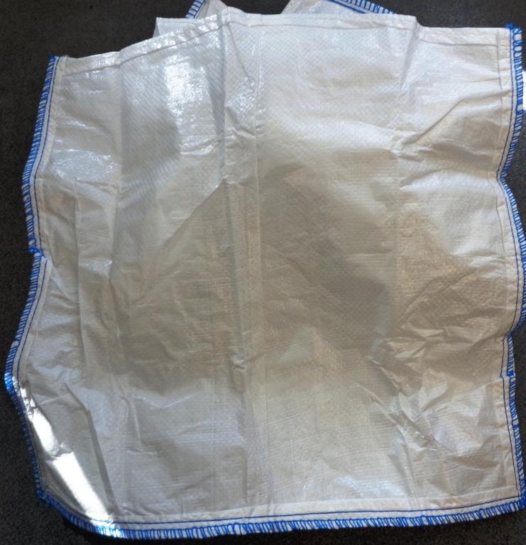 A BAG/SACK OF WOVEN FABRIC CONSISTING OF POLYPROPYLENE/POLYETHYLENE STRIPS OF A WIDTH EXCEEDING 5MM. THE POLYPROPYLENE/POLYETHYLENE IS EXTRUDED INTO A FILM AND THEN SLITTED INTO STRIPS OF A WIDTH EXCEEDING 5MM. THE STRIPS ARE WOVEN ON A CIRCULAR LOOM TO OBTAIN THE FABRIC WHICH IS THEN LAMINATED WITH A SUITABLE POLYMER AND SEWN INTO SACKS AND BAGS.