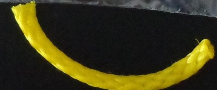 3/8 INCH, HOLLOW, TUBULAR BRAID IN THE PIECE. MADE OF POLYPROPYLENE. NOT TIGHTLY PLAITED. YELLOW IN COLOUR. DECITEX 17 GR/M