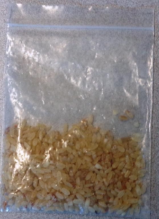 ROUND GRAIN RICE THAT HAS BEEN SOAKED, PARBOILED, SEMI-MILLED, AND PACKAGED. THE AVERAGE LENGTH OF WHOLE GRAINS IS FIVE MILLIMETRES, AND THE AVERAGE WIDTH IS 3 MILLIMETRES. THE RATIO BETWEEN THE LENGTH AND THE WIDTH OF THE GRAINS IS LESS THAN TWO. THE GRAINS MAINLY HAVE A LIGHT BROWN APPEARANCE WITH A FEW BEING A DARKER BROWN. THE RICE IS READY FOR RETAIL SALE IN PACKAGES OF VARYING SIZES.