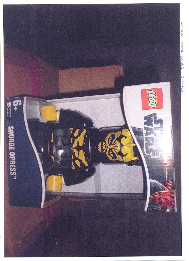 LEGO STAR WARS ALARM CLOCK. A DIGITAL DISPLAY CLOCK HOUSED IN A LEGO FIGURE OF A STAR WARS CHARACTER.