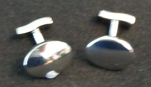 SOLID BRASS CUFF LINK PLATED WITH WHITE STEEL. THE CUFF LINKS ARE AVAILABLE AS SQUARE, OVAL OR RECTANGULAR SHAPE WITH A POLISHED MIRROR FINISH. THE CUFF LINKS ARE PRESENTED FOR RETAIL SALE IN A LAMINATED CARDBOARD BOX WITH OTHER ITEMS (NOT PART OF THIS CLASSIFICATION).