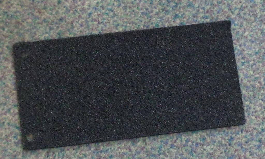 RUBBER UNDERLAY FLOOR COVERING MADE FROM RECYCLED TYRE TREAD WITH A LATEX BONDING AGENT. IT IS THREE MILLIMETRES THICK. IT IS BACKED WITH A THIN NON WOVEN POLYPROPYLENE MATERIAL WHICH IS STICKY AND COVERED WITH A FILM WHICH PEELS OFF WHEN READY FOR USE.  EACH ROLL OF UNDERLAY IS ONE METRE WIDE AND FIFTEEN METRES LONG. THE EDGES ARE NOT MOULDED OR BEVELLED.