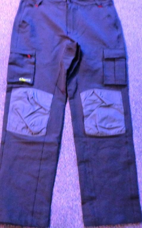 WOVEN MENS RACE SAILING TROUSERS OF 96% NYLON AND 4% ELASTINE. TWO HIP POCKETS AT THE FRONT, AND TWO THIGH POCKETS. THE RIGHT HAND THIGH POCKET CLOSES WITH A ZIP AND THE LEFT HAND ONE CLOSES WITH VELCRO ATTACHMENTS. THE KNEES AND SEAT ARE REINFORCED WITH ABRASION RESISTANCE. HAS A ZIP CLOSURE AND LEFT OVER RIGHT FASTENING WITH A BUTTON. HAS BELT LOOPS AROUND THE WAIST. CONTAINED IN A TRANSPARENT PLASTIC BAG.