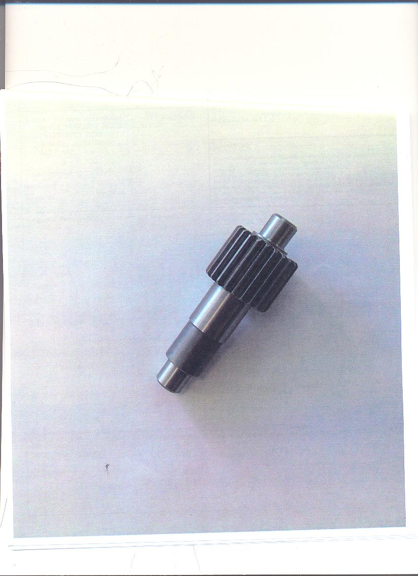 STEEL GEAR USED AS PART OF A GEARBOX IN AN ENGINE THAT IS USED IN AN ELECTRIC WHEELCHAIR.