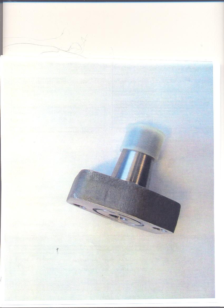 PUMP FLANGE USED IN A FUEL PUMP WHICH IS PART OF AN ENGINE USED IN A WHEELCHAIR.