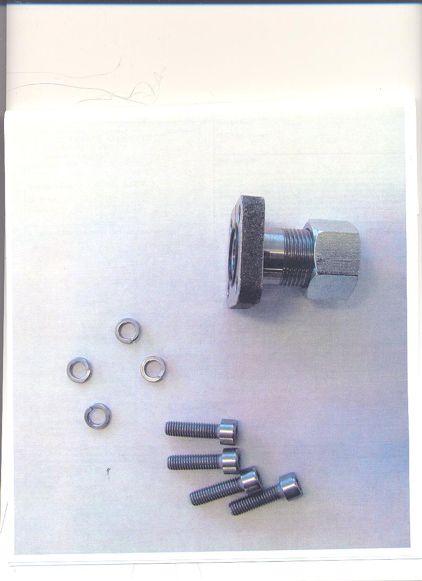 CONNECTION KIT USED IN A FUEL PUMP WHICH IS PART OF AN ENGINE USED IN A WHEELCHAIR. CONSISTS OF FOUR SCREWS, FOUR WASHERS AND A CONNECTION PLATE WHICH HOUSES A NUT AND BOLT.