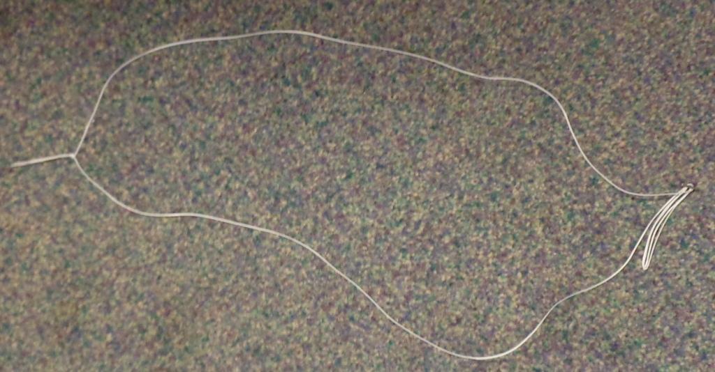 NON STERILE SURGICAL SUTURE MADE OF 100% SPECTRA. THE SPECTRA IS BRAIDED. WITH A TITANIUM BUTTON ATTACHED TO THE SUTURE. IT IS SURGICALLY IMPLANTED AND REMAINS IN THE PATIENT.